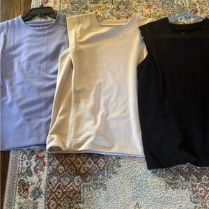 Sleeveless Tops in Black, Cream, and Lavender - Athleta